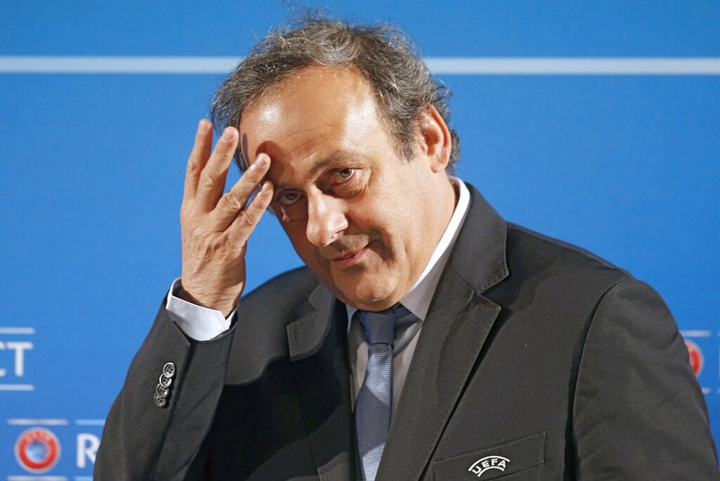In this Feb.22, 2014 file photo, UEFA President Michel Platini arrives at a press conference, one day prior to the UEFA EURO 2016 qualifying draw in Nice, southeastern France. Former UEFA president Michel Platini has been arrested Tuesday June 18, 2019 over the awarding of the 2022 World Cup. (AP Photo/Lionel Cironneau, File)