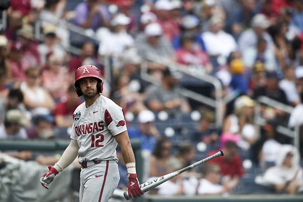 Arkansas catcher Casey Opitz walks toward the dugout during a College World Series game against Texas Tech on Monday, June 17, 2019, in Omaha, Neb. 