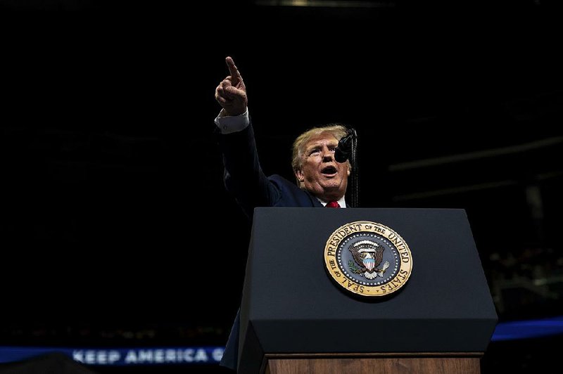 President Donald Trump speaks to the crowd Tuesday evening at the Amway Center in Orlando, Fla. 