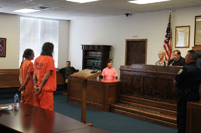 David and Mary Black stand Tuesday before Lincoln County District Judge Phillip Green (right) during a probable cause hearing after their arrests in the death of their 11-year-old son, Joseph Carsello. 