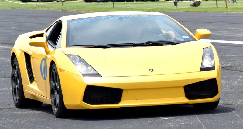 Westside Eagle Observer/MIKE ECKELS A Lamborghini Spyder returns to the staging area after making a 120-mile-per-hour run down Crystal Lake Airport's runway June 15. This car was part of the Exotic Experience Car Show in Decatur.