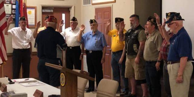 Photo submitted Performing the installation of officers for 2019-2020 (in front with back turned) is Jacob Greeling, historian, for Bella Vista's American Legion Post 341. Officers installed (left) are Brad Kennell, commander; Jeff Vermurlen, executive committee; John Chelstrom, executive committee; Norvil Lantz, chaplain; David Niemann, first vice commander; Nathan Vail, second vice commander; Greg Helle, finance officer; Gene Rogers, judge advocate; and Don Naught, sergeant at arms.