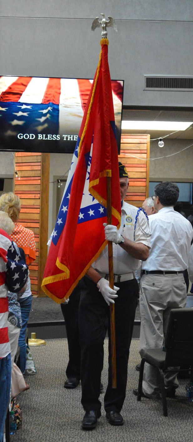 Herald-Leader/Sierra Bush Members of the Siloam Springs American Legion Post 29 retire the colors following the Siloam Springs Republican Women's patriotic sing-along program Monday.