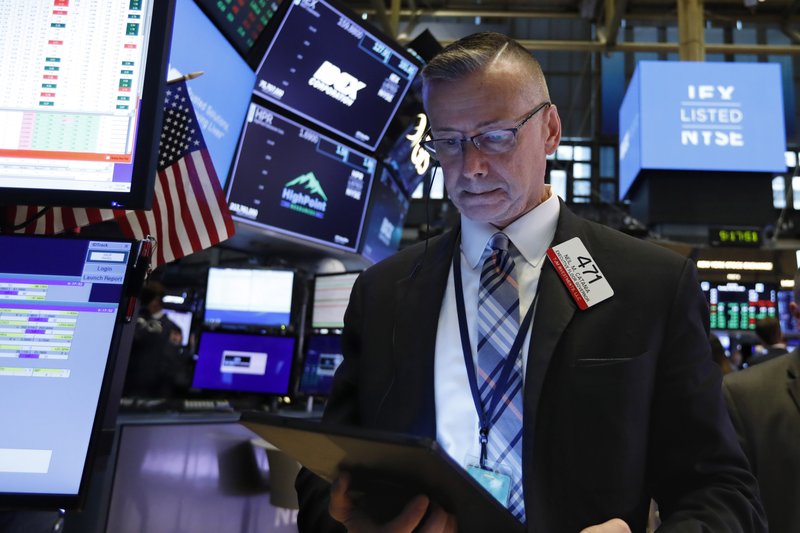 Trader Neil Catania works on the floor of the New York Stock Exchange, Tuesday, June 18, 2019. Stocks are opening higher on Wall Street following big gains in Europe after the head of the European Central Bank said it was ready to cut interest rates and provide more economic stimulus if necessary. (AP Photo/Richard Drew)