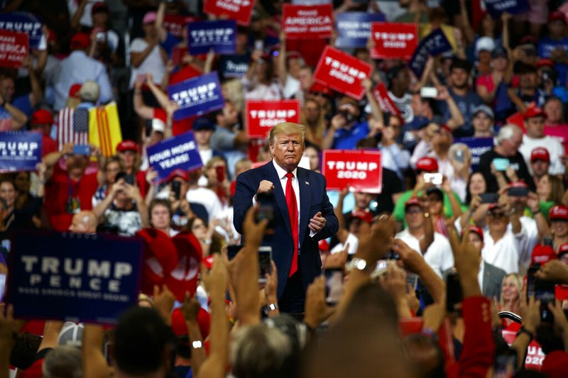 President Donald Trump pumps his fist after speaking during his re-election kickoff rally at the Amway Center, Tuesday, June 18, 2019, in Orlando, Fla. (AP Photo/Evan Vucci)
