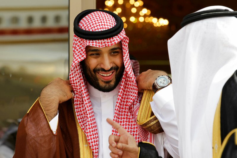 In this May 14, 2012 file photo, Prince Mohammed bin Salman speaks with a Saudi prince in Riyadh, Saudi Arabia. An independent U.N. human rights expert investigating the killing of Saudi journalist Jamal Khashoggi on Wednesday June 19, 2019, recommended an investigation into the possible role of Saudi Crown Prince Mohammed bin Salman, citing "credible evidence." (AP Photo/Hassan Ammar, File)