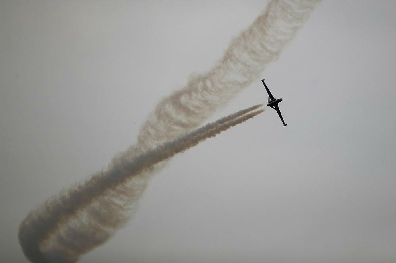 A French Fouga Magister jet trainer aircraft performs a demonstration flight Tuesday at the Paris Air Show, one of the aviation industry’s biggest exhibitions.