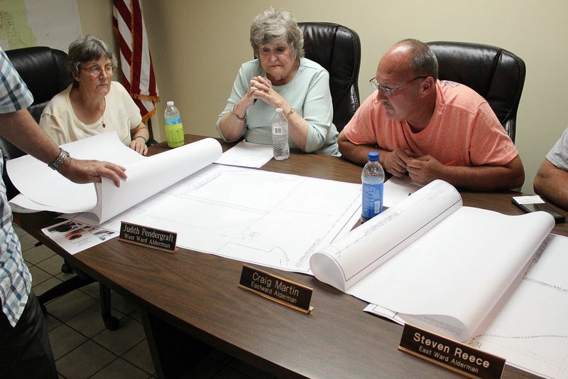 MEGAN DAVIS/MCDONALD COUNTY PRESS Council members reviewed maps of Southwest City's water system and discussed the best course of action for replacing the outdated lines.