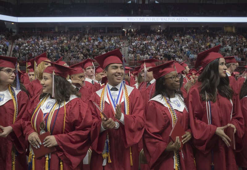 Springdale High graduates react after receiving their diplomas during a graduation ceremony, Saturday, May 18, 2019 at Bud Walton Arena in Fayetteville.
