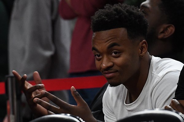 Justice Hill watches from behind the Arkansas bench during a game against Florida on Wednesday, Jan. 9, 2019, at Bud Walton Arena in Fayetteville. 