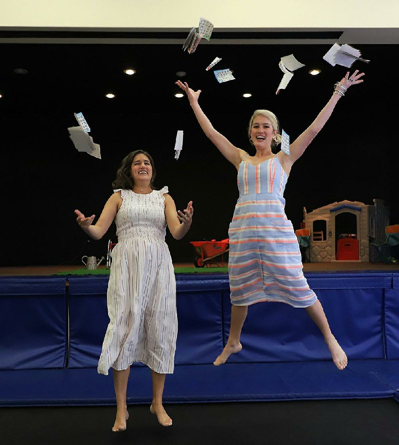 Callie Gutierrez (left) and Chandler Bailey throw caution — and several dozen bingo cards — to the wind. 