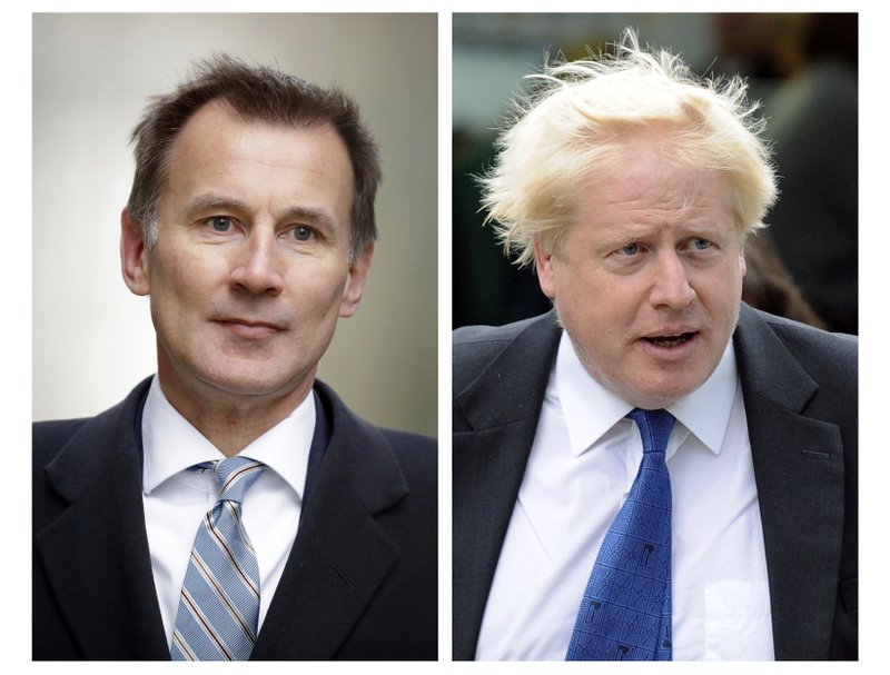 FILE - In this two photo file combo image, Jeremy Hunt, left, and Boris Johnson, right, who are the final two contenders for leadership of the Conservative Party, Thursday June 20, 2019. Following elimination votes Britain's Conservative Party members will vote for the final two contenders with the winner due to replace Prime Minister Theresa May as party leader and prime minister. (AP Photo FILE/Matt Dunham, Frank Augstein)