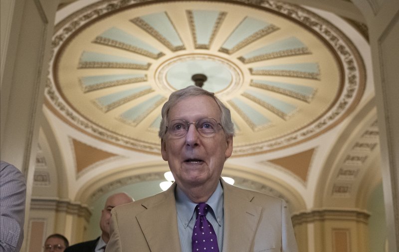 Senate Majority Leader Mitch McConnell, R-Ky., walks to his office after speaking on the Senate floor at the Capitol in Washington, Thursday, June 20, 2019. Speaker of the House Nancy Pelosi, D-Calif., meets with reporters before joining congressional leaders at a closed-door security briefing on the rising tensions with Iran, at the Capitol in Washington, Thursday, June 20, 2019. (AP Photo/J. Scott Applewhite)
