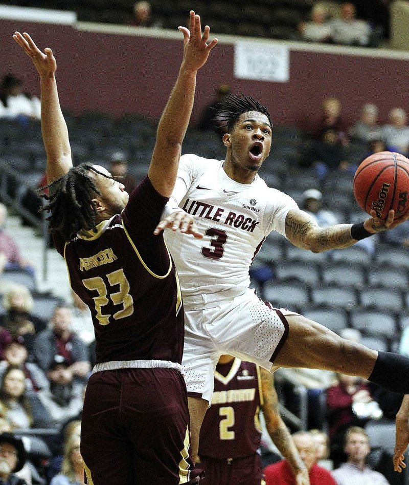 FILE - UALR's Rayjon Tucker (3) lays in a shot over Texas State's Alex Peacock (23) at the Jack Stephens Center in Little Rock in this Saturday, Feb. 16, 2019, file photo. 