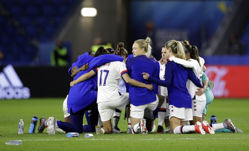 United States players embrace following their team's 2-0 win over Sweden in the Women's World Cup Group F soccer match at Stade Oc&#xe9;ane, in Le Havre, France, Thursday, June 20, 2019. (AP Photo/Alessandra Tarantino)
