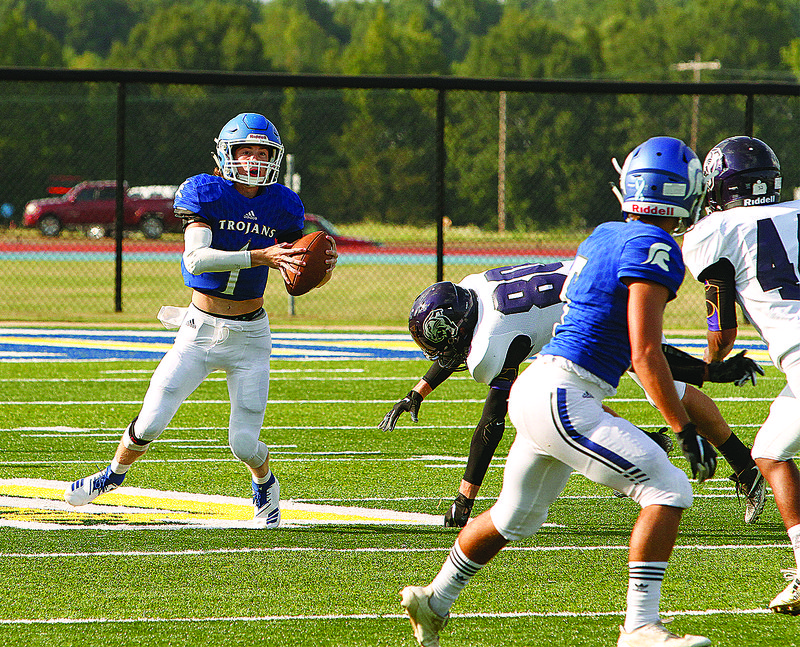 Parkers Chapel's Caleb Jacobs looks for a receiver in the Trojans' season opener last season against Fouke at Southern Arkansas University in Magnolia. Jacobs plans to participate in the Manning Passing Academy next week at Nicholls State University in Thibodeaux, Louisiana.