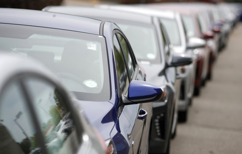 A long line of unsold 2019 sedans sits at a dealership in Littleton, Colo. in May.