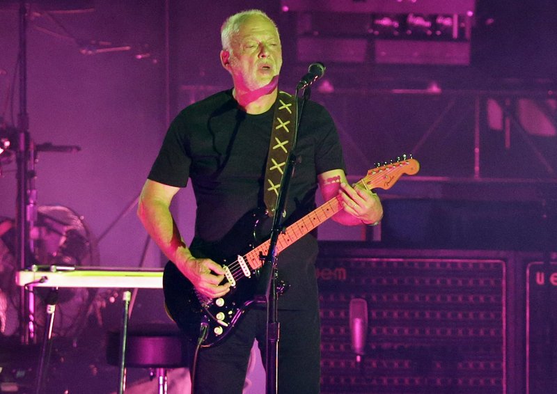  In this July 7, 2016, file photo, musician David Gilmour performs in the ancient roman amphitheater of the Pompeii archeological site, Italy. 