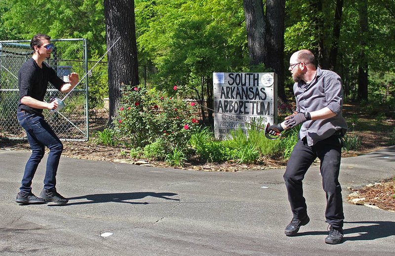 Renaissance Faire: Dalton McCuistion (left) and Justin Howard engage in a traditional rapier fight at the Fellowship of the Spring Renaissance Fairen held at the Arboretum in April. Howard’s fight choreography saw him eventually battling with two rapiers versus McCuistion’s one; however, McCuistion still emerged victorious when Howard yielded the fight to him.