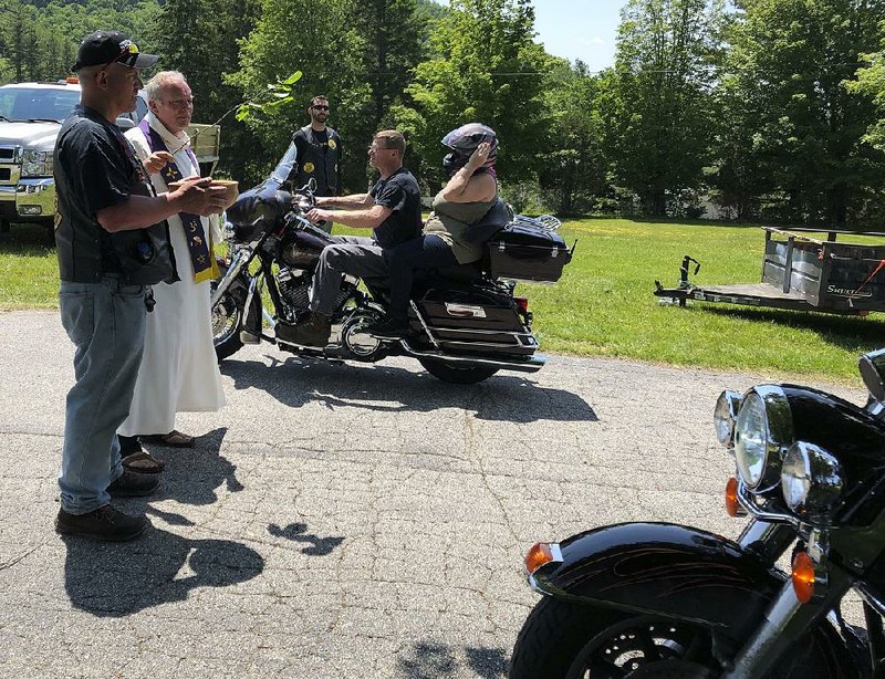 Motorcyclists participate in a Blessing of the Bikes ceremony in Columbia, N.H., on Sunday, two days after a truck crashed into a group of 10 motorcycles and killed seven people. 