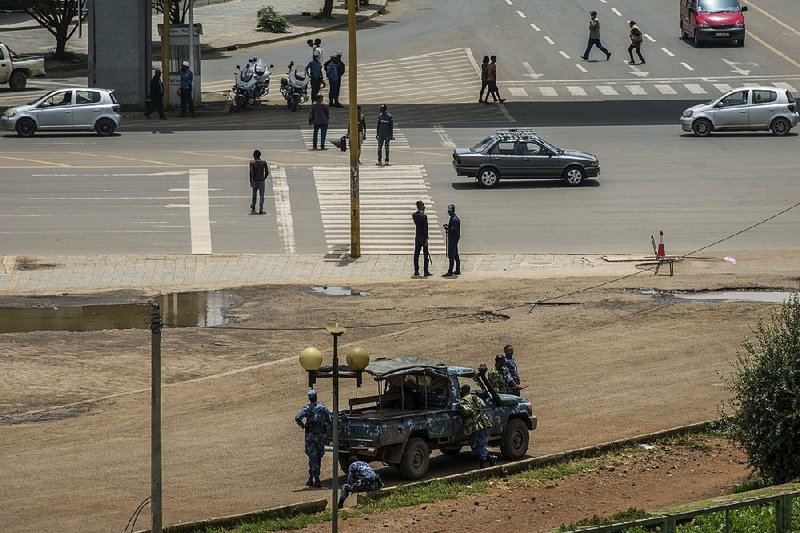 Security forces stand guard Sunday in Meskel Square in central Addis Ababa, Ethiopia. 