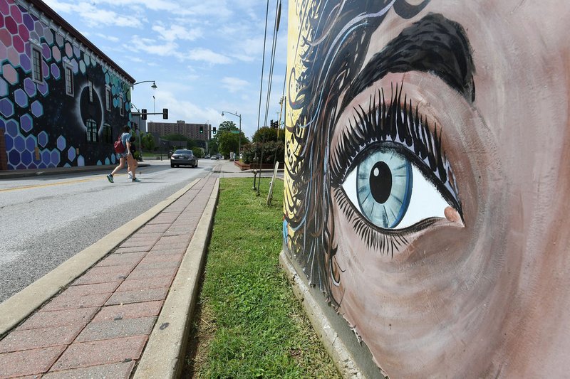 NWA Democrat-Gazette/J.T. WAMPLER Pedestrians cross West Ave. Wednesday June 12, 2019 near Dickson St.
The city&#xe2;&#x20ac;&#x2122;s cultural arts corridor will span West Avenue from Dickson Street to the Fayetteville Public Library. On Tuesday, the City Council approved an agreement to work with Experience Fayetteville on programming, marketing, operations and maintenance of the public spaces within the corridor.