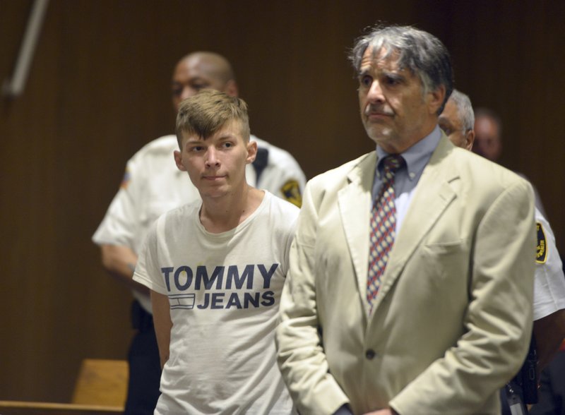 Volodymyr Zhukovskyy, 23, of West Springfield, stands with his attorney Donald Frank during his arraignment in Hampton District Court, Monday, June 24, 2019, in Springfield, Mass. Zhukovskyy, the driver of a truck in a fiery collision on a rural New Hampshire highway that killed seven motorcyclists, was charged Monday with seven counts of negligent homicide. (Don Treeger/The Republican via AP, Pool)