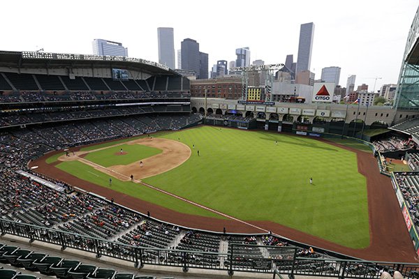 The roof of Minute Maid ballpark is open showing a portion of the Houston downtown skyline during an exhibition baseball game between the Houston Astros and the Kansas City Royals Saturday, April 4, 2015, in Houston. (AP Photo/Pat Sullivan)

