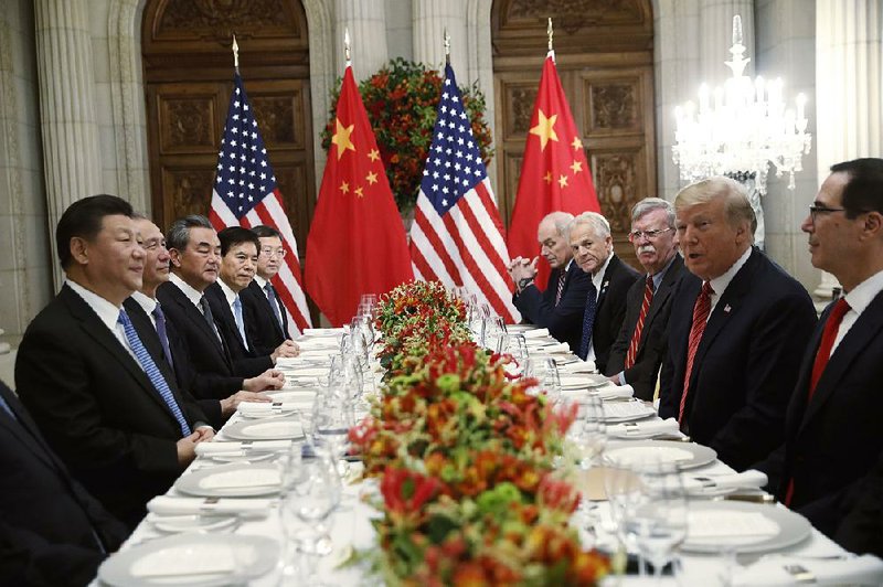 President Donald Trump (second from right) meets with Chinese President Xi Jinping (left) in December at the Group of 20 summit in Buenos Aires, Argentina. The two leaders plan to meet again this week at a G-20 gathering in Japan. 