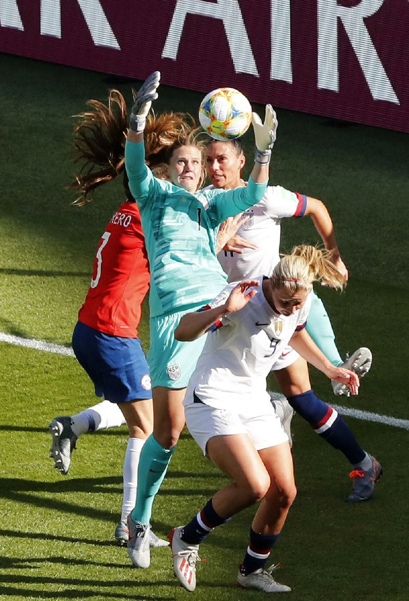United States goalkeeper Alyssa Naeher (center) jumps for the ball during the team’s 2-1 victory over Spain in the Women’s World Cup in Reims, France.