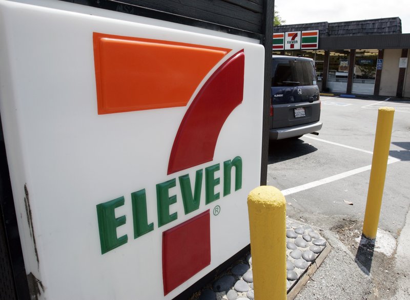 FILE - In this July 1, 2008 file photo, a 7-Eleven is shown in Palo Alto, Calif. The convenience-store chain is launching a service that lets customers order everything from its trademark frozen drink to a battery charger and have it delivered to a public place like a park or a beach. The retailer told The Associated Press that more than 2,000 7-Eleven &quot;hot spots&quot; including New York's Central Park and Venice Beach in Los Angeles will be working starting Monday, June 24, 2019. (AP Photo/Paul Sakuma, File)