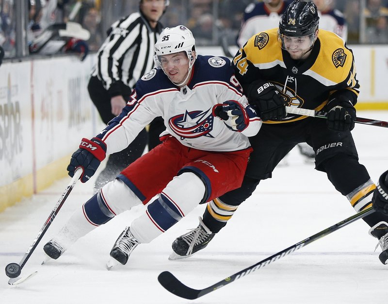 FILE - In this March 16, 2019, file photo, Columbus Blue Jackets' Matt Duchene, left, battles Boston Bruins' Jake DeBrusk (74) for the puck during the first period of an NHL hockey game in Boston. Duchene is one of the top players available in free agency.(AP Photo/Michael Dwyer, File)