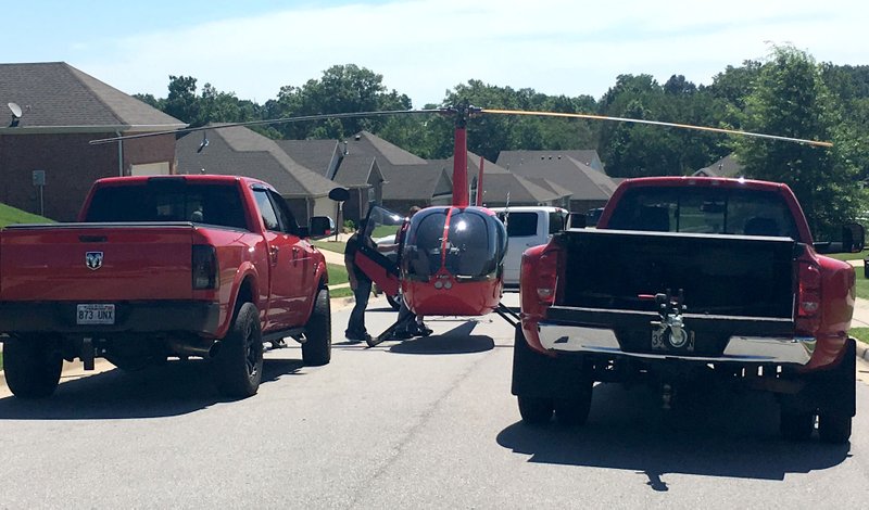 NWA Democrat-Gazette/TRACY NEAL A helicopter made an emergency landing Tuesday, June 25, 2019 on Curtis Street in Centerton.