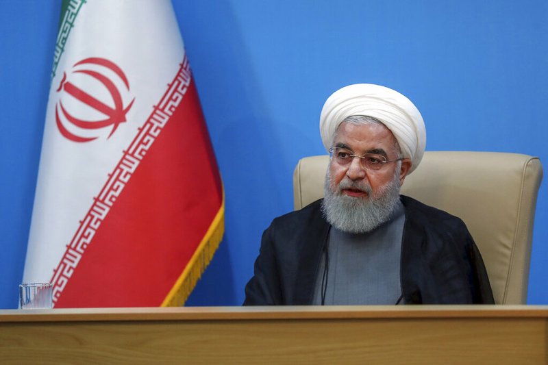 In this photo released by the official website of the office of the Iranian Presidency, President Hassan Rouhani attends a meeting with the Health Ministry officials, in Tehran, Iran, Tuesday, June 25, 2019. Iran on Tuesday sharply criticized new U.S. sanctions targeting the Islamic Republic's supreme leader and other top officials, saying the measures spell the "permanent closure" for diplomacy between the two nations. For his part, Iran's president described the White House as "afflicted by mental retardation." (Iranian Presidency Office via AP)