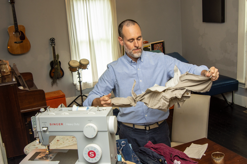 James Matthews prepares clothing for use in his quilts. Matthews’ exhibition at the Arts & Science Center for Southeast Arkansas in Pine Bluff continues through Sept. 28. (Arkansas Democrat-Gazette/CARY JENKINS)