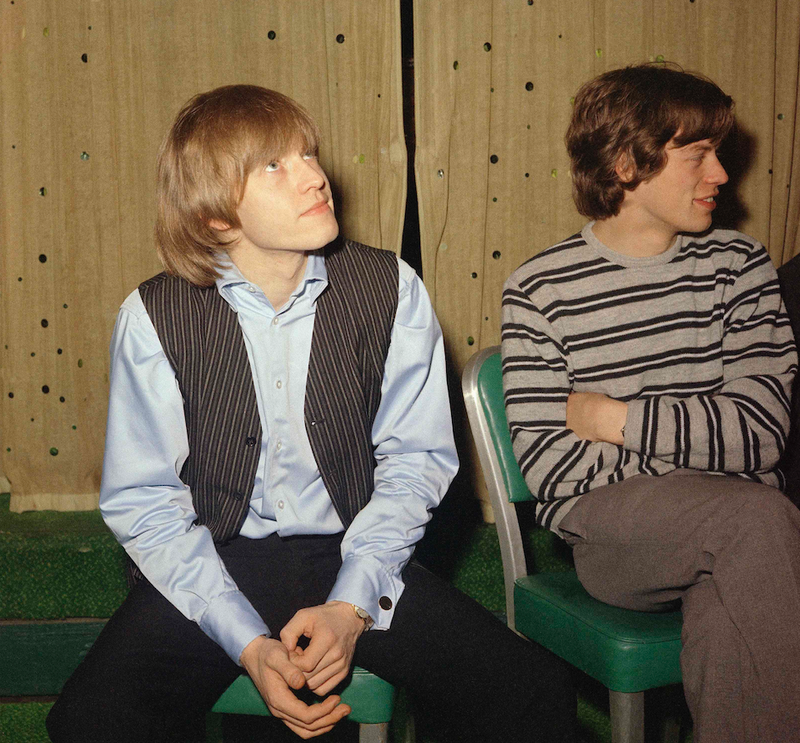 Brian Jones (left) sits with Mick Jagger at an interview in 1965. (AP)
