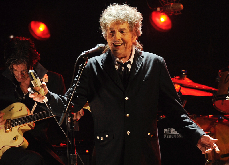  In this Jan. 12, 2012, photo, Bob Dylan performs in Los Angeles. A new book, "Bob Dylan's Poetics: How the Songs Work" takes an insightful look at his songs. (AP)
