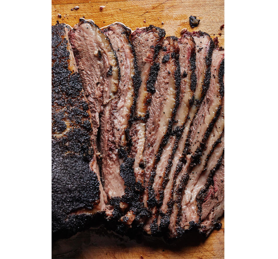 Carving a brisket flat is easy: Simply slice it across the grain to the thickness of a No. 2 pencil. Carving a packer brisket is more challenging because the meat fibers of the point run almost perpendicular to those of the flat. Photo by Tara Donne (The New York Times)