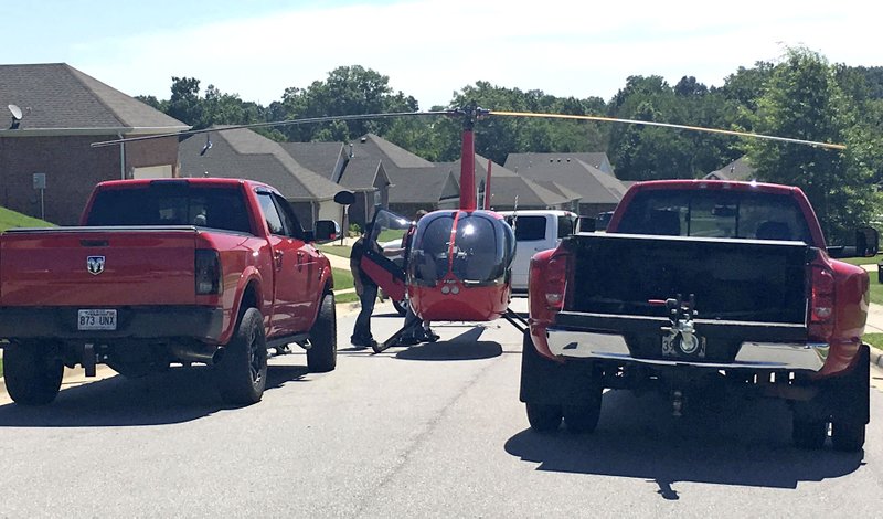 NWA Democrat-Gazette/TRACY NEAL A helicopter made an emergency landing Tuesday in a Centerton neighborhood.