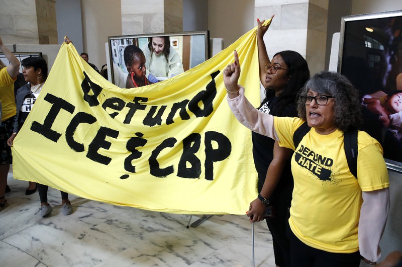 Protesters gather to demand the defunding of government agencies for border protection and customs enforcement, Tuesday, June 25, 2019, on Capitol Hill in Washington. (AP Photo/Patrick Semansky)

