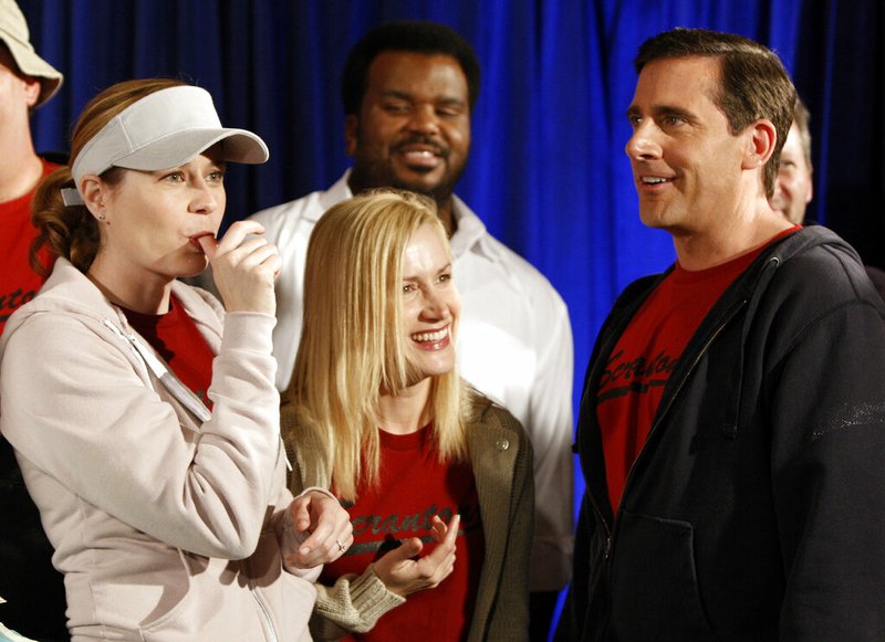 In this April 14, 2009, file photo cast members, from left, Jenna Fischer, Angela Kinsey, Craig Robinson, and Steve Carell are seen after cutting a cake celebrating the 100th episode of the television show "The Office" in Malibu, Calif. Netflix's announced that NBC's hit show "The Office" will be pulled from its lineup after 2020 and head to NBCUniversal's upcoming service. In a tweet Tuesday, June 25, Netflix said it was "sad" that NBC was taking back the show but added it will still be on Netflix for the next year and a half (AP Photo/Matt Sayles, File)