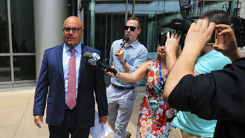 Jeremy Hutchinson (left) leaves federal court in Little Rock on Tuesday after pleading guilty to two charges. With a related plea agreement in Missouri, the former state senator faces a possible 13-year sentence.
