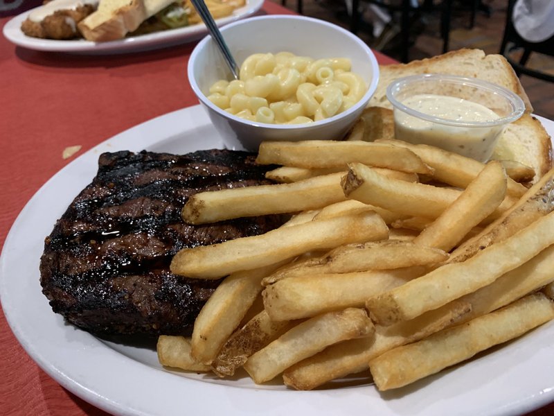 The sirloin steak comes with two sides -- in this case, fries and macaroni &amp; cheese -- at Grub's Bar &amp; Grille in the Village at Pleasant Valley on Little Rock's North Rodney Parham Road. Arkansas Democrat-Gazette/Eric E. Harrison
