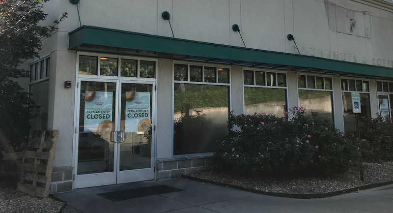 Signs in the window and the lack of signs on the sides of the building (below) are proof that the Krispy Kreme on Little Rock's Shackleford Road has closed. Arkansas Democrat-Gazette/Josh Snyder