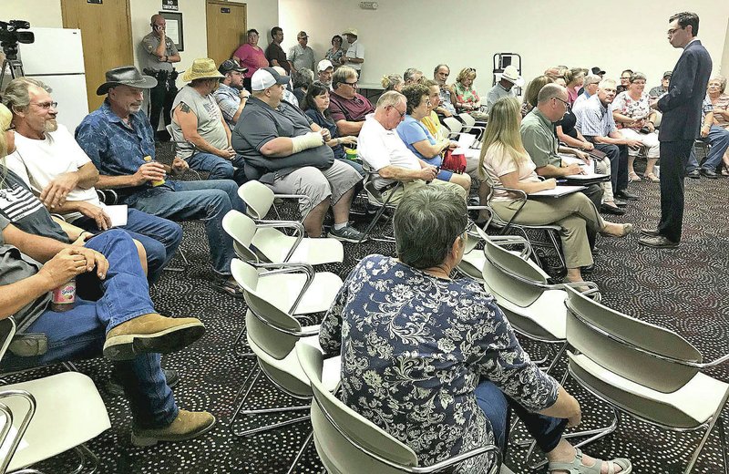 NWA Democrat-Gazette/DOUG THOMPSON Missouri Rep. Dirk Deaton, R-Noel, addresses residents Tuesday in Anderson, Mo. The group demanded tighter environmental scrutiny of a liquid waste-spreading operation operated by a Northwest Arkansas-based business.