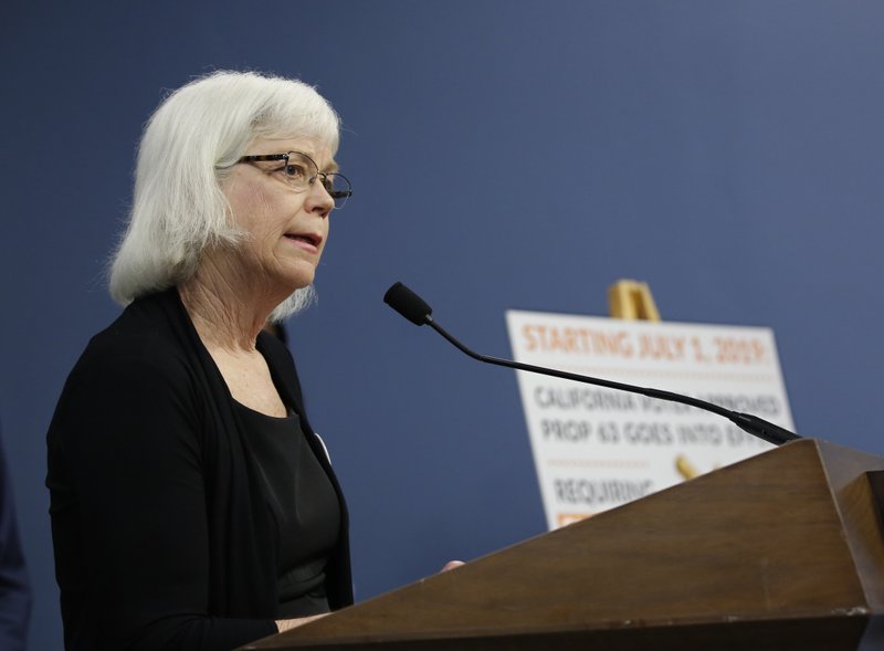 Amanda Wilcox, spokeswoman for the Brady Campaign to Prevent Gun Violence, discusses a 2016 voter-approved ballot initiative that will require Californians to undergo criminal background checks every time they buy ammunition starting July 1 during a news conference in Sacramento, Calif., Tuesday, June 25, 2019.  (AP Photo/Rich Pedroncelli)