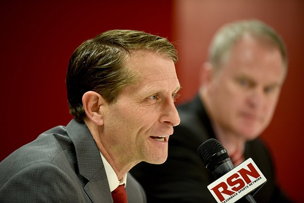 Arkansas basketball coach Eric Musselman speaks to reporters while athletics director Hunter Yurachek looks on during a news conference Monday, April 8, 2019, in Fayetteville. 