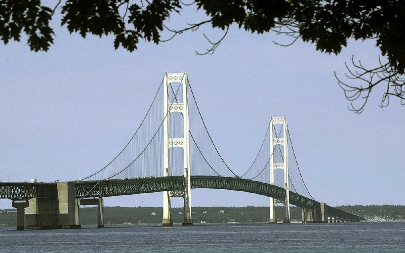 The Mackinac Bridge in Michigan spans the Straits of Mackinac between Lakes Huron and Michi- gan, site of two aging oil pipelines the Michigan attorney general says pose an “unacceptable risk” of a major leak. 