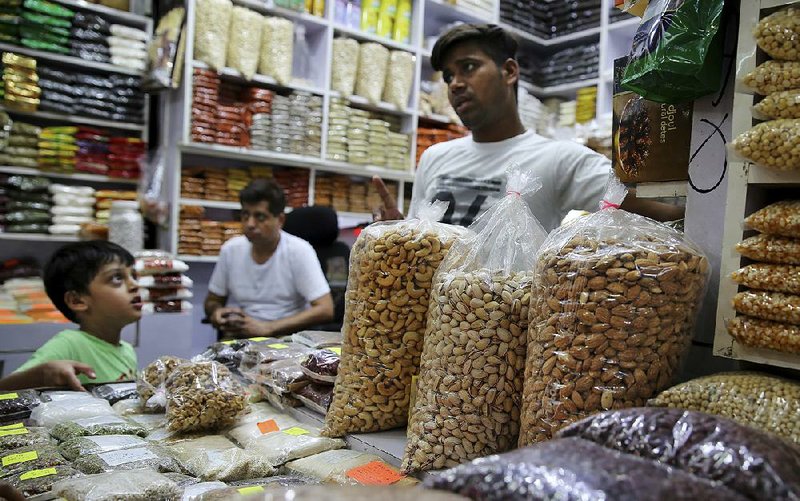 California almond kernels are displayed for sale in a shop in New Delhi. India’s tariffs add about 12 cents per pound to shelled nuts and about 4 cents for those in the shell. 