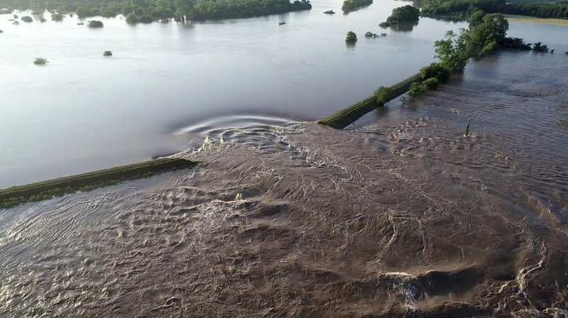 FILE - In this May 31, 2019 file photo, an aerial image provided by Yell County Sheriff's Department shows water rushing through the levee along the Arkansas River in Dardanelle. (Yell County Sheriff's Department via AP-File)